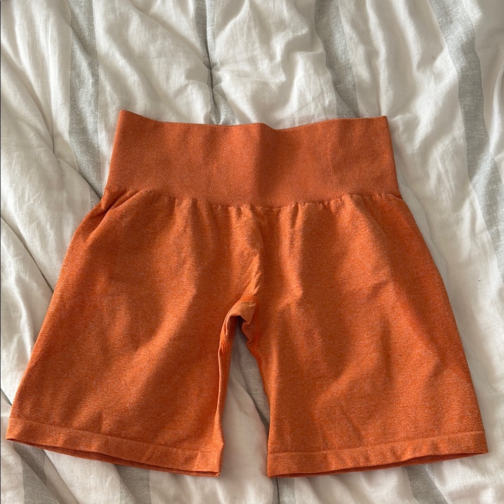 NVGTN Orange High-Waisted Gym Shorts